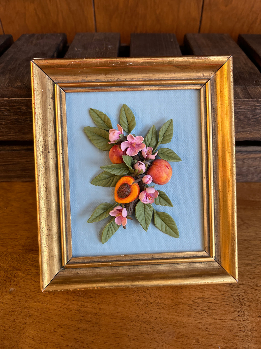 clay flowers and peach frame